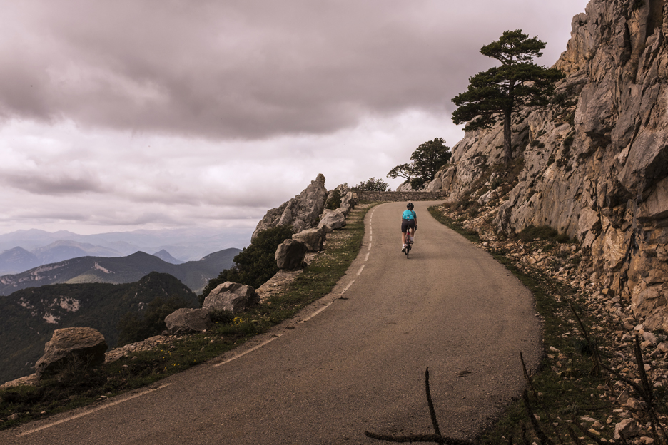 Riding up hill at sunset on a SHIMANO equipped road bike 