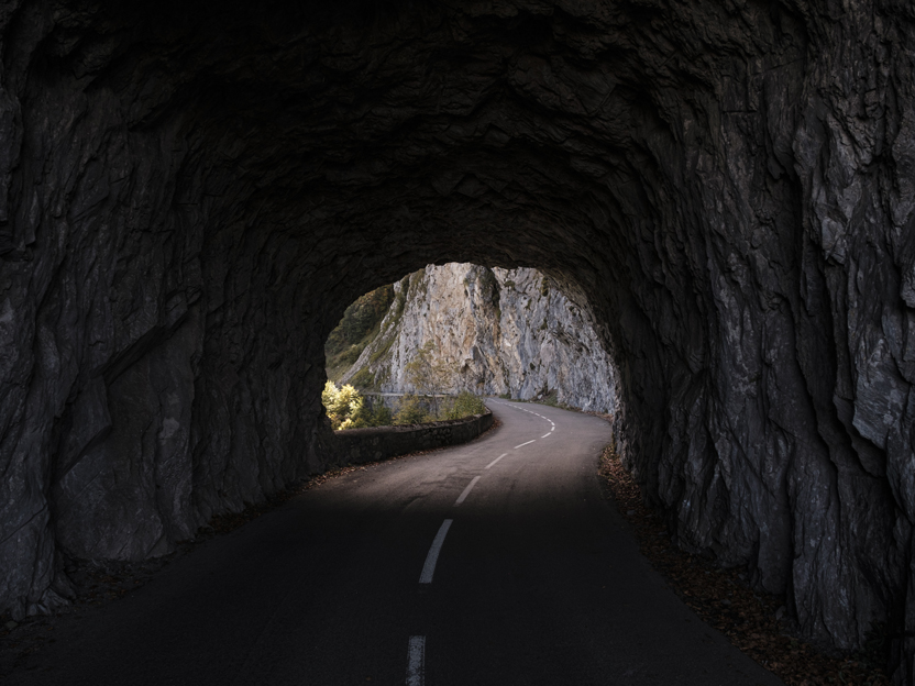 Riding a SHIMANO road bike through a dark tunnel in Europe