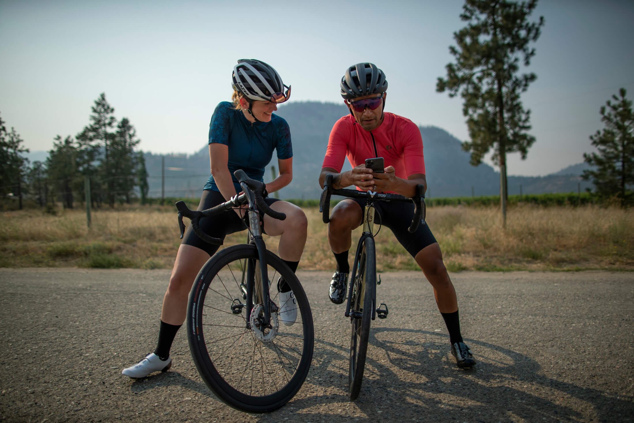 Two road cyclist getting thoer bike set up on a ride with Shimano e-tube project 